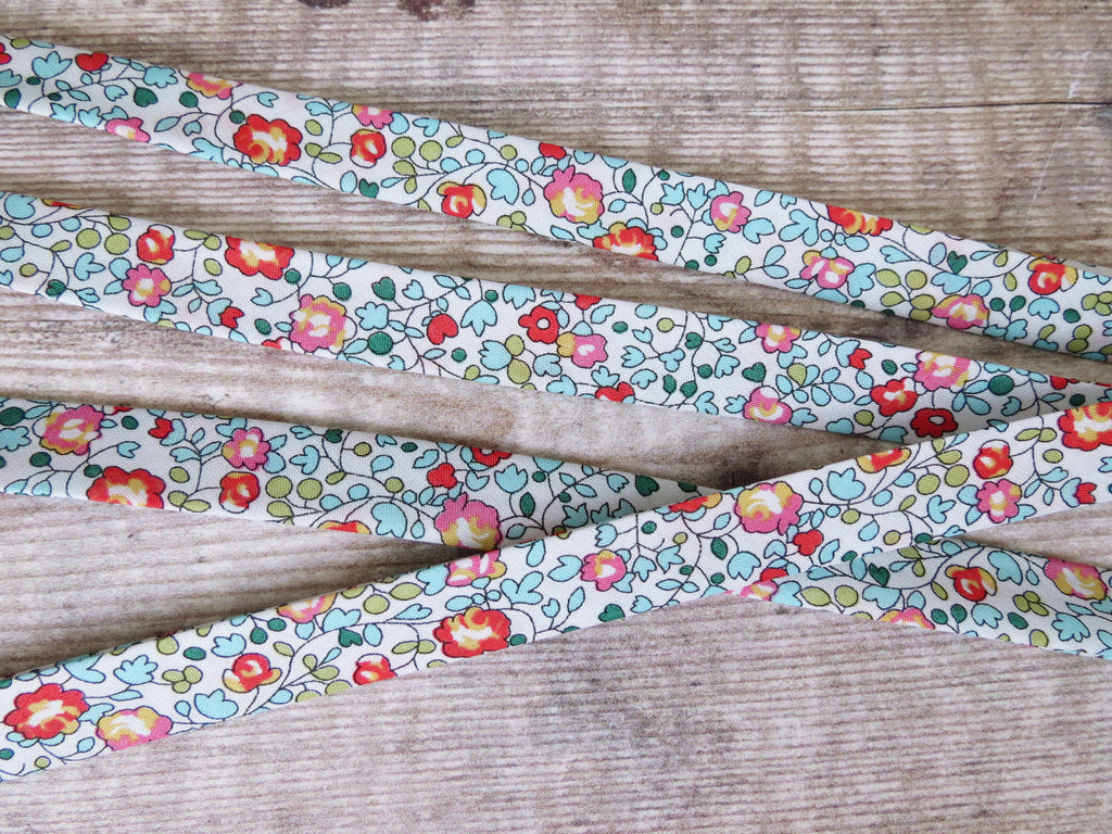 Turquoise and red floral bias binding with Eloise B floral pattern