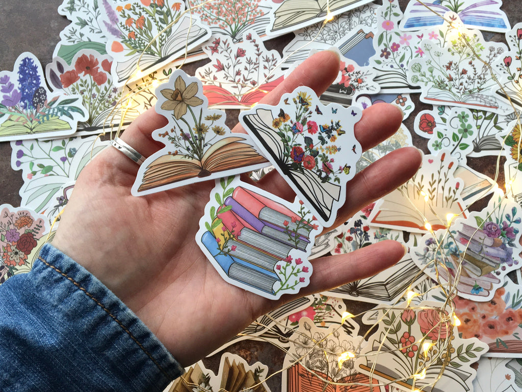 vinyl laptop stickers with illustrated floral book designs