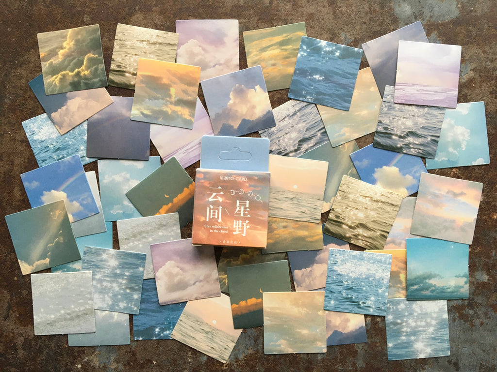 'Sparkling seas and drifting clouds' sticker box