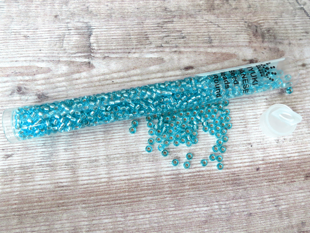 Silver lined aqua seed beads