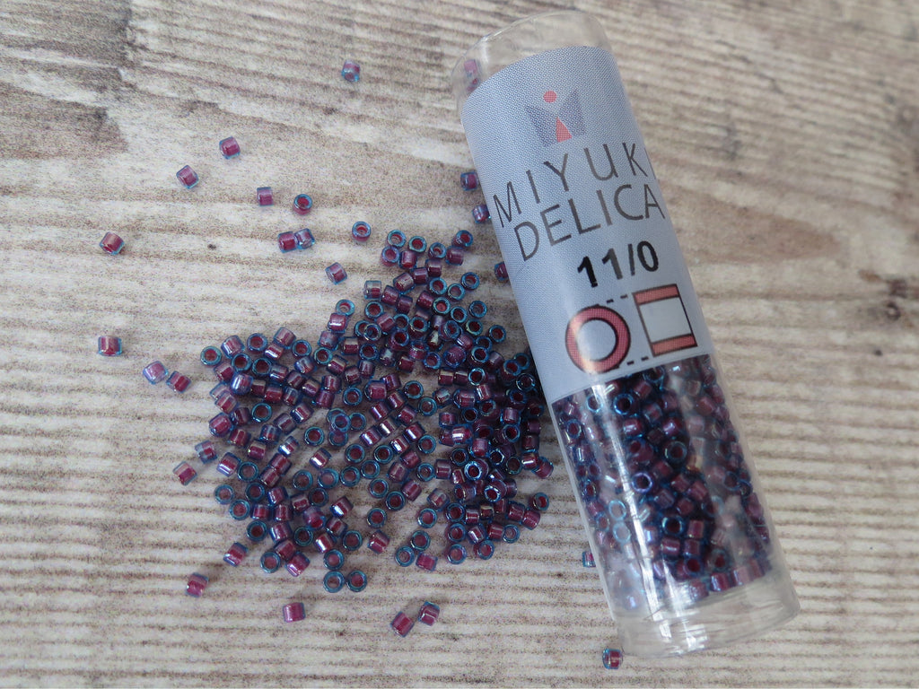 Delica seed beads size 11/0 in Hot Pink lined Aqua AB
