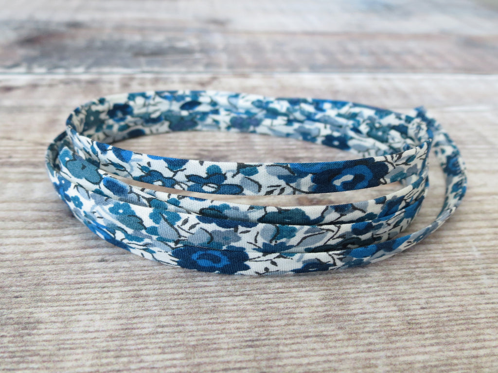 Blue and white fabric ribbon with floral print