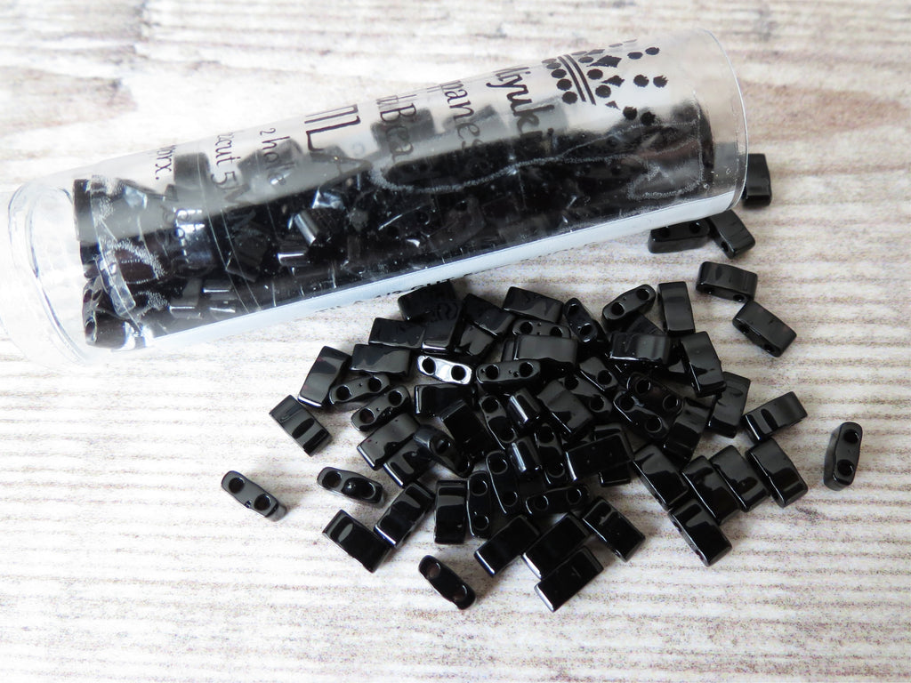Half cut tila beads in black