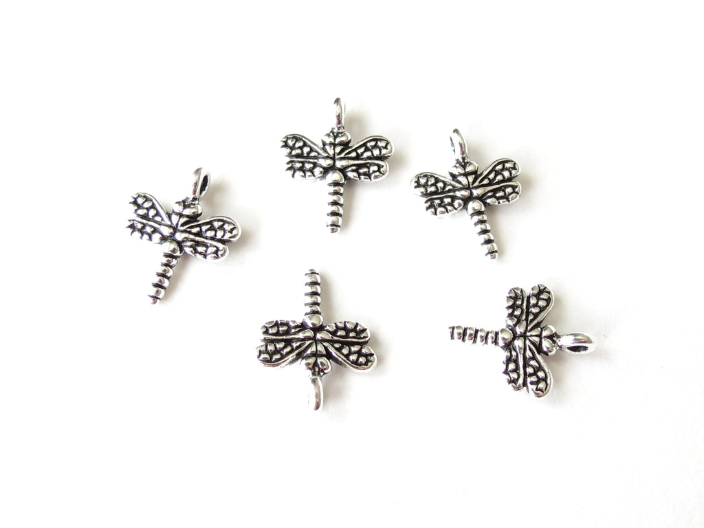 Small dragonfly jewellery charm made by TierraCast in antique silver finish